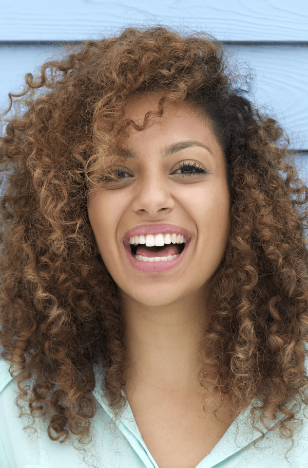 A woman is joyfully smiling