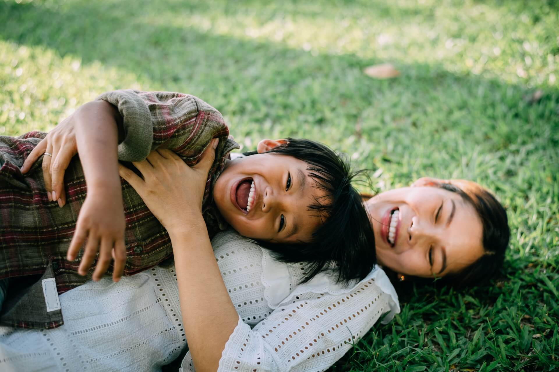 Give Your Child a Head Start with Early Treatment. A mother is smiling with her son in the nature